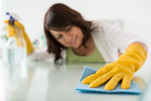 Oven cleaner working in a SW16 kitchen with careful access