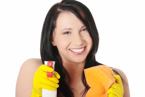 Local cleaner washing a shopfront in SW16